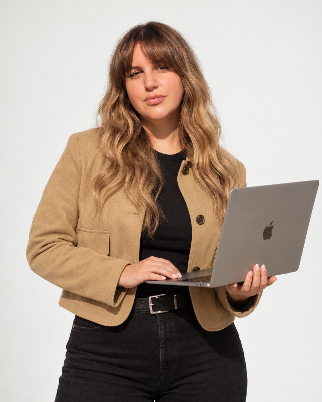 Jessa Black holding a MacBook Pro, author of the San Diego holiday market vendor checklist