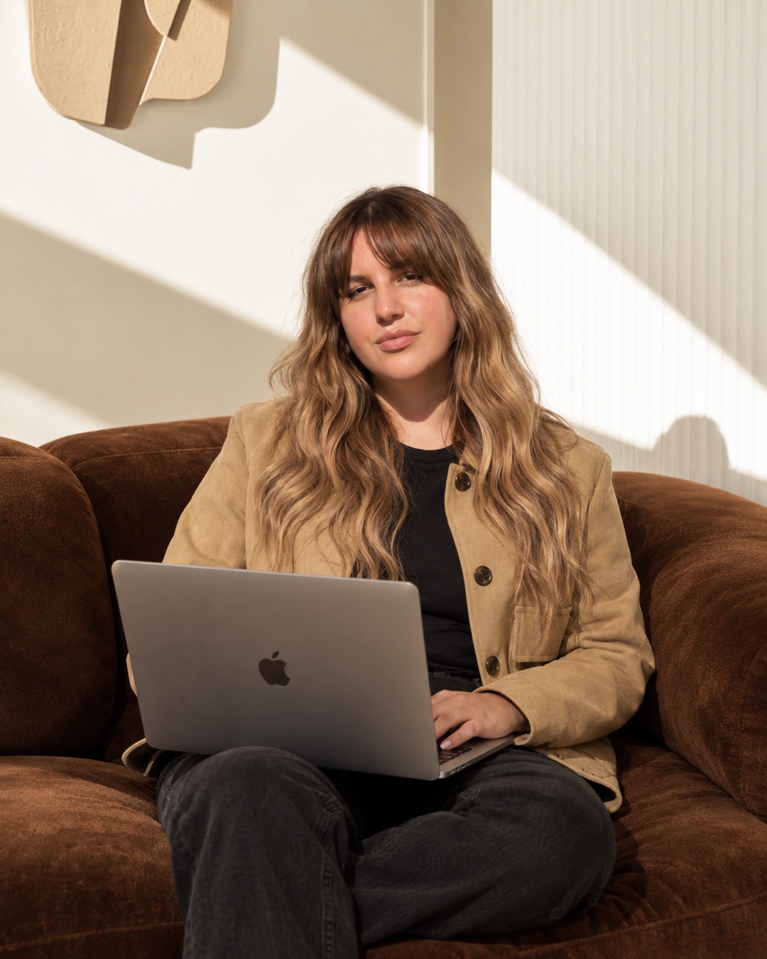 Jessa Black with a MacBook Pro, author of the San Diego holiday marketing checklist